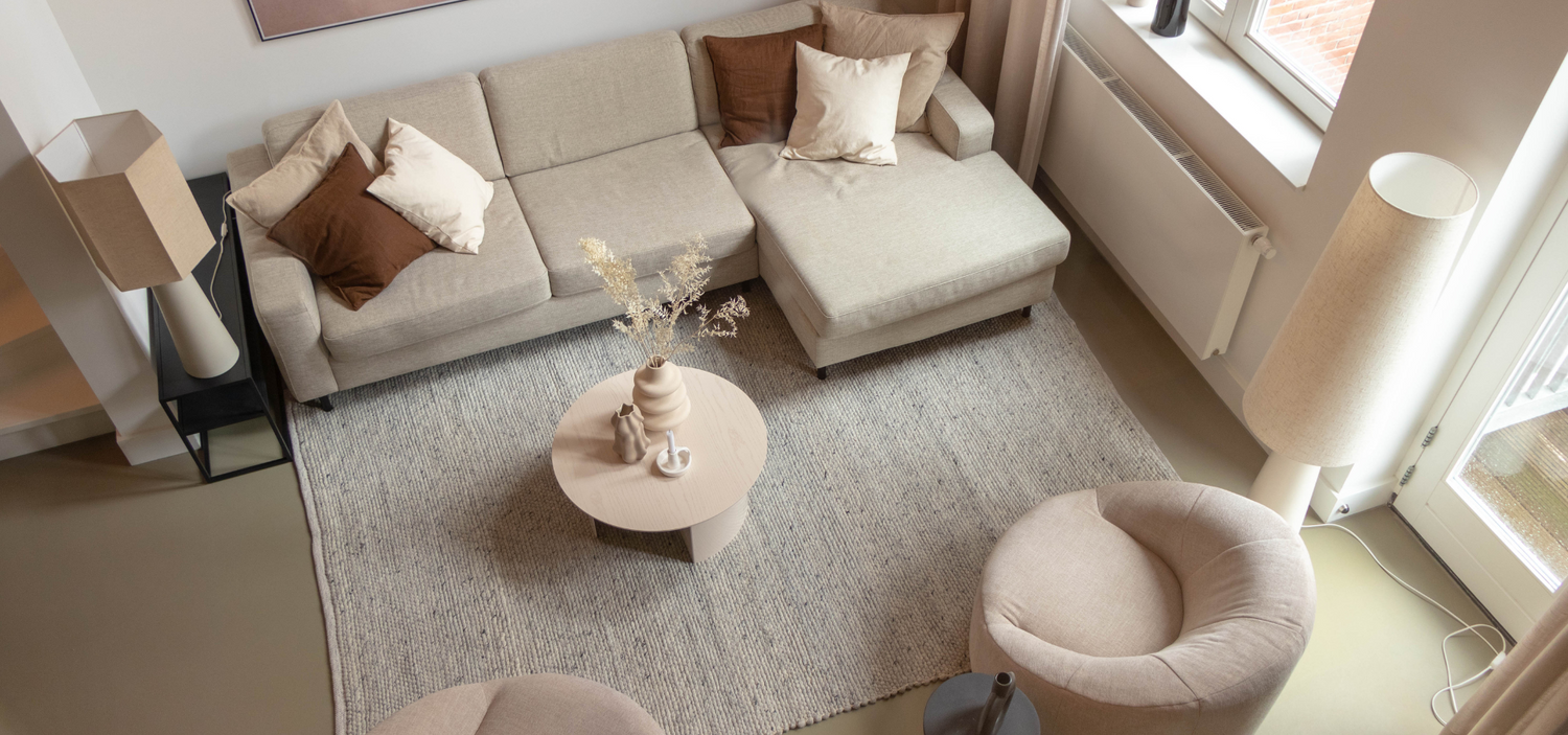 How do you position a rug by the sofa?