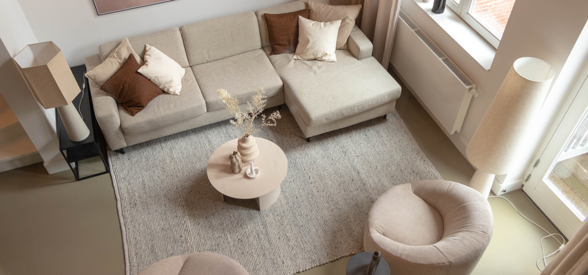 How do you position a rug by the sofa?